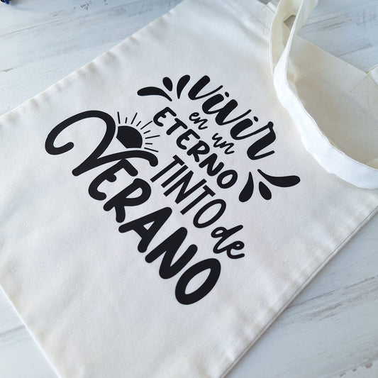 Vivir en un eterno tinto de verano · Tote bag