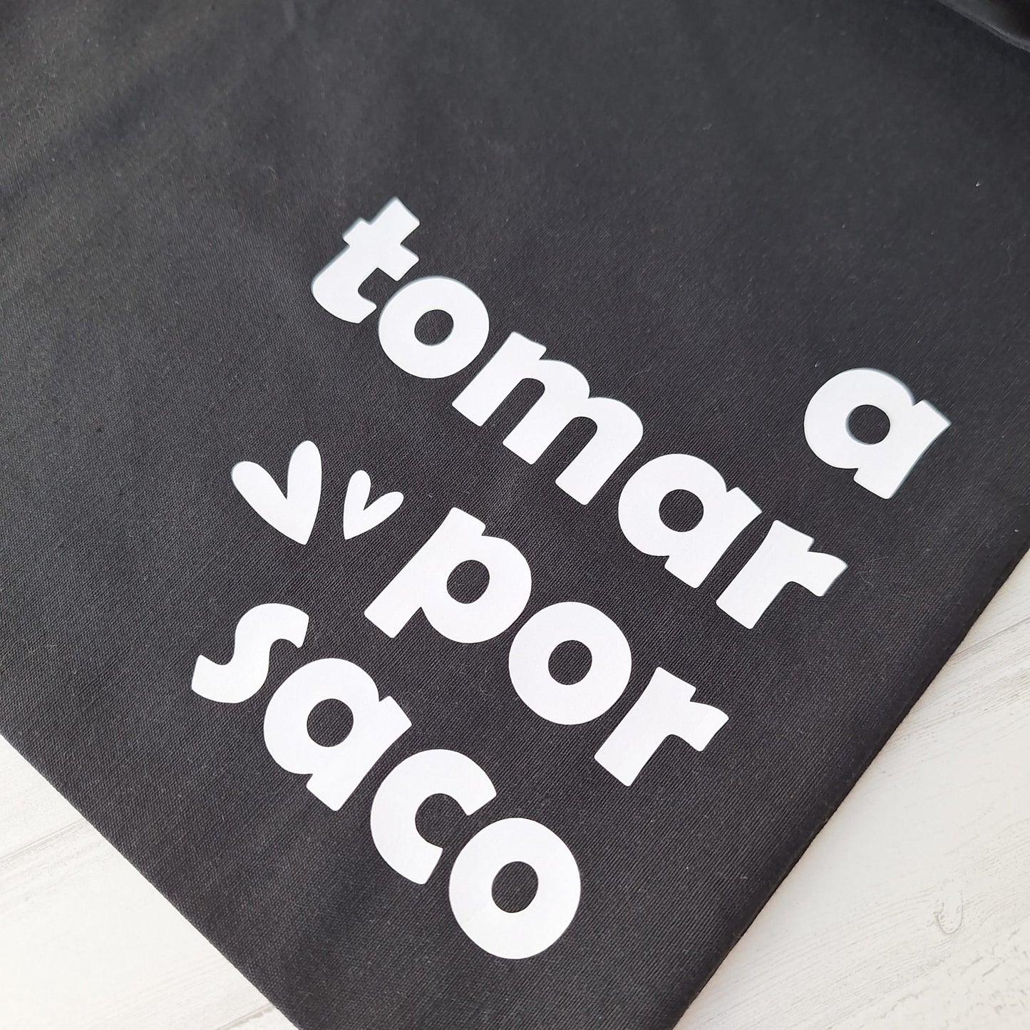 A tomar por saco · Tote bag