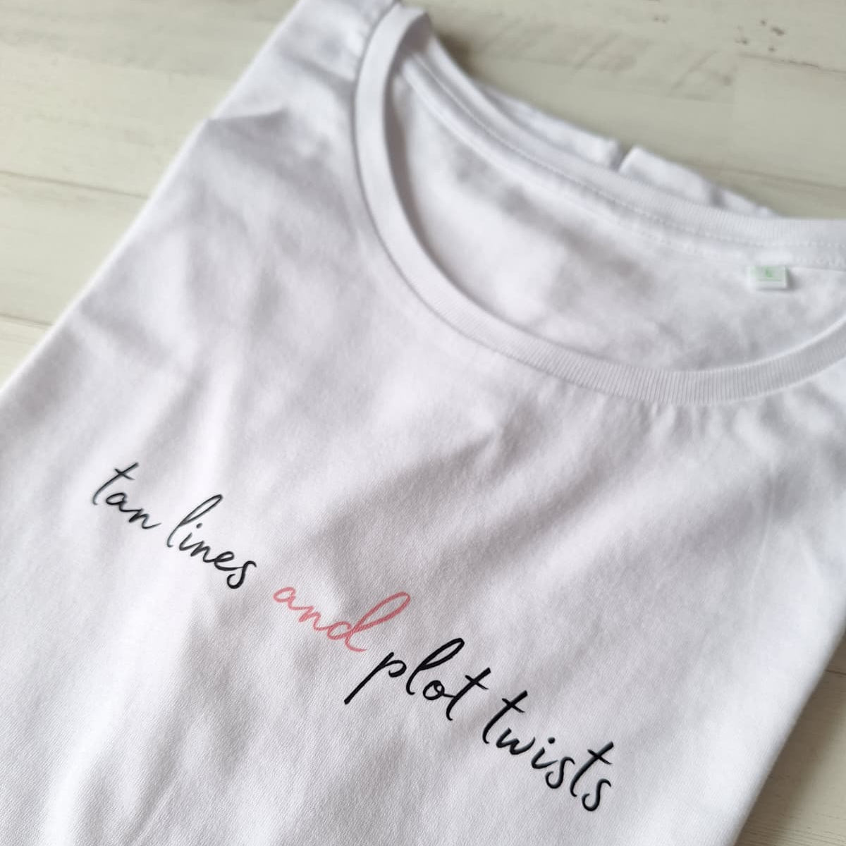 Tan lines and plot twist  · Camiseta