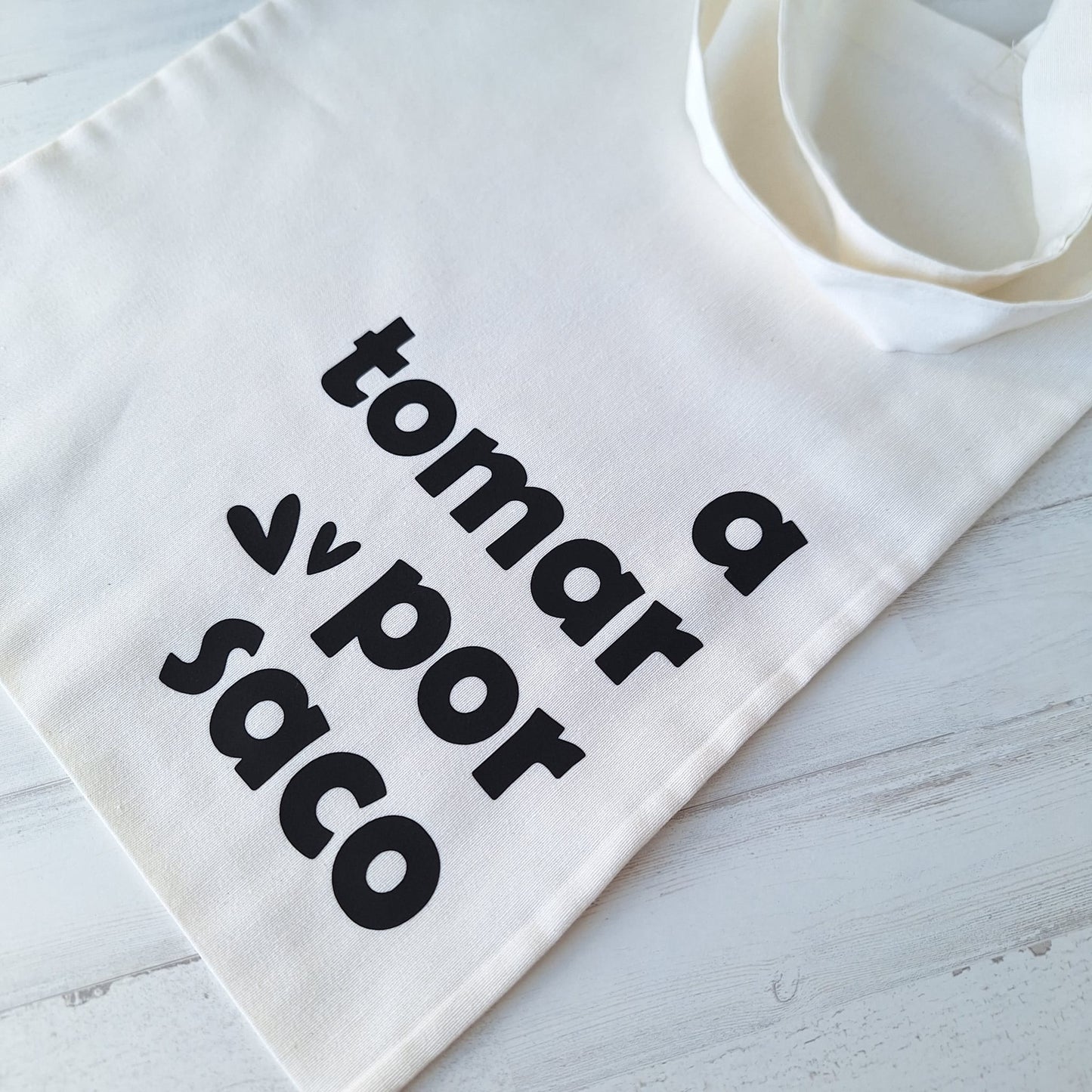 A tomar por saco · Tote bag