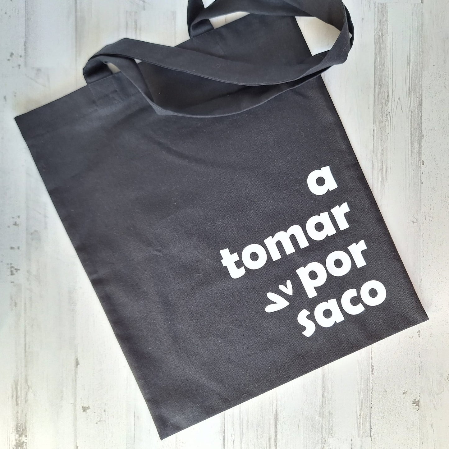 A tomar por saco · Tote bag