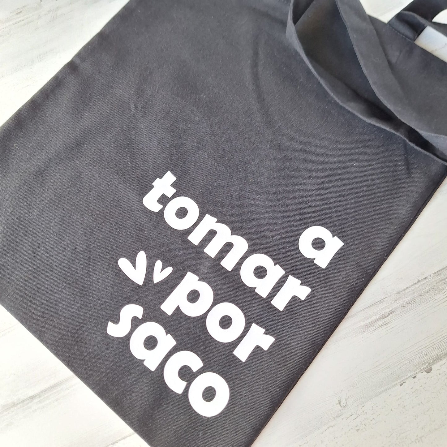 A tomar por saco · Tote bag
